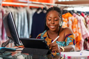 Female entrepreneur looking at PayPal Pay Later purchases from customers on her laptop