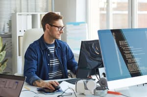 Man sitting in front of his computer in an office
