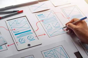 Designer planning application process development prototype wireframe for web mobile phone