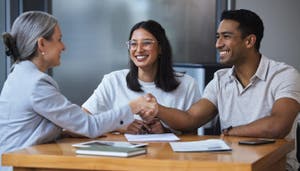 A couple speaking to a consultant